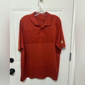 Antigua Men's Rust Red Polo with Subtle Chest Pattern